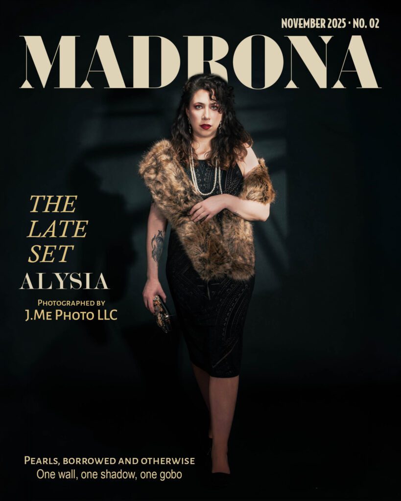 Alysia in a black beaded dress and fur stole against a dark wall, on the November 2025 cover of Madrona