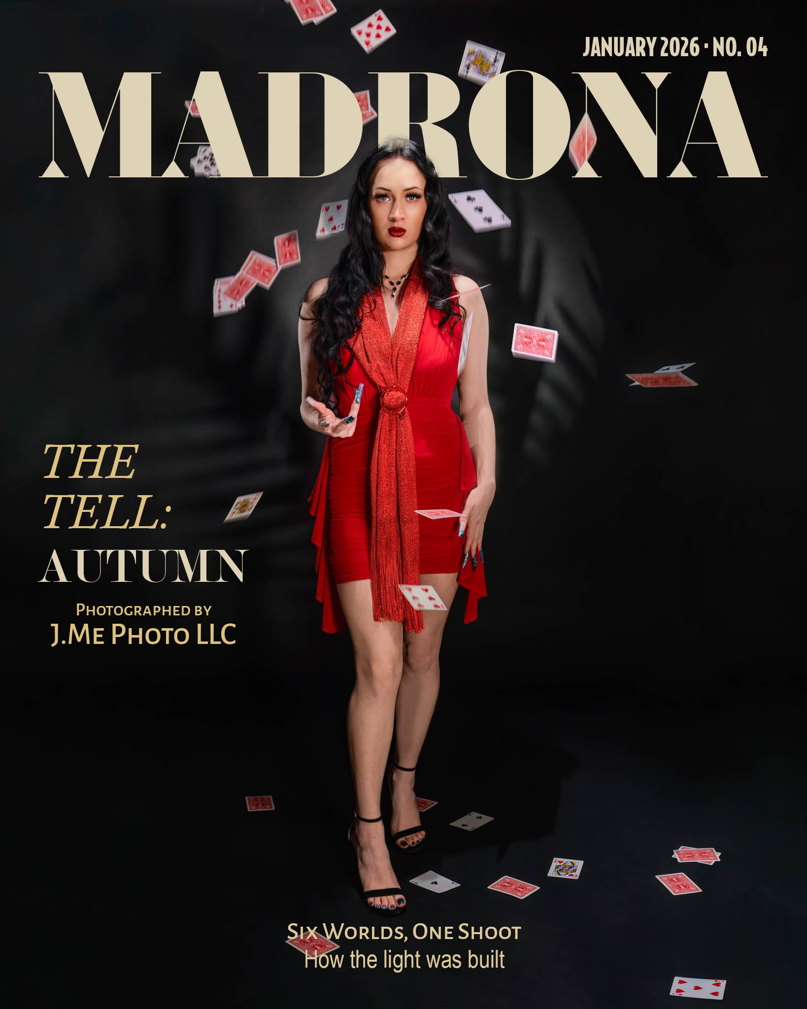 Autumn in a red dress and scarf with playing cards falling around her, on the January 2026 cover of Madrona